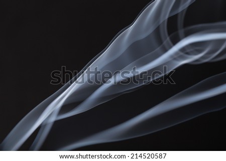White smoke on black background. To be used as background.