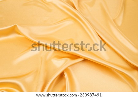 Yellow cloth silk texture close up. Whole background.