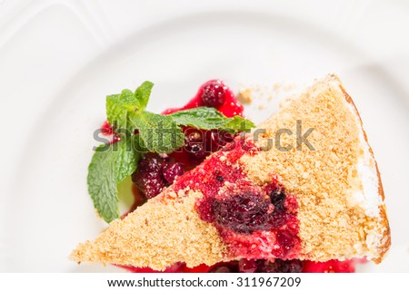 Manhattan cheesecake with berry jam and mint. Macro. Photo can be used as a whole background.