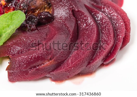Grilled foie gras covered with forest berries and stewed pear with red sauce. Macro. Photo can be used as a whole background.