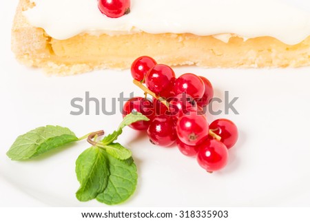 Lemon pie with sweet cream and red currant. Macro. Photo can be used as a whole background.