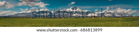 Extra wide panorama of High Tatra mountains during April with snowy hills / Vysoke Tatry / Slovakia Foto stock © 