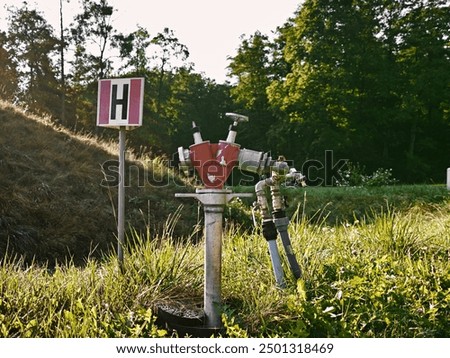 Similar – Image, Stock Photo Street, meadow with distribution box, facades of single-family houses, small town