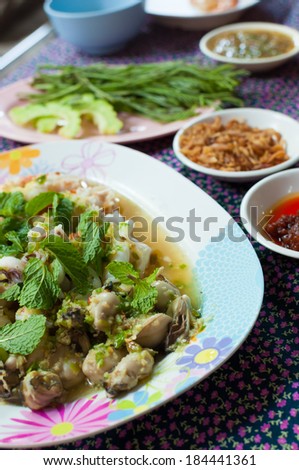 Oyster shrimp squid with side dishes such as vegetables, pepper, garlic