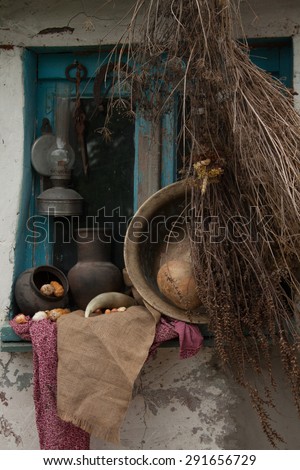 Retro rural life with a copper basin, corn, horseshoe pitcher and the old blue box