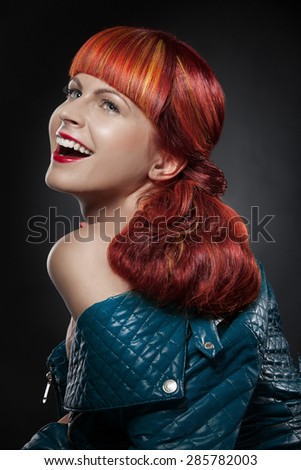 Red Hair. Fashion Girl Portrait isolated over black background