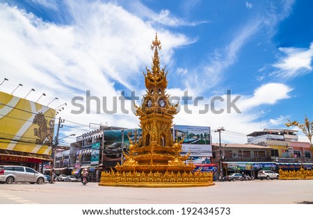 CHIANGRAI,THAILAND-MAY12 :Golden clock tower,Not have any effect.After the 6.3magnitude earthquake.establis hed in 2008 by Thai visual artist Chalermchai Kositpipatat May12,2014 in ChiangRai,Thailand.
