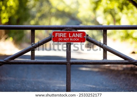 Similar – Foto Bild Dreckiges Feuerwehrzufahrt-Schild und Winterdienst-Schild vor einem öffentlichen Gebäude