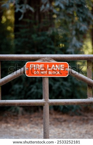 Similar – Foto Bild Dreckiges Feuerwehrzufahrt-Schild und Winterdienst-Schild vor einem öffentlichen Gebäude