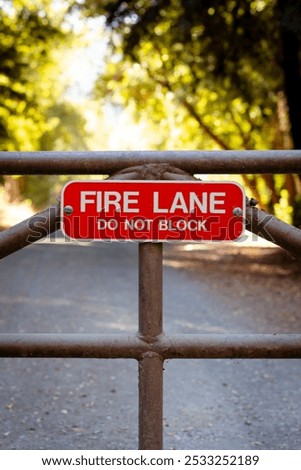 Similar – Foto Bild Dreckiges Feuerwehrzufahrt-Schild und Winterdienst-Schild vor einem öffentlichen Gebäude