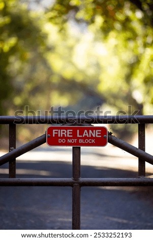 Similar – Foto Bild Dreckiges Feuerwehrzufahrt-Schild und Winterdienst-Schild vor einem öffentlichen Gebäude