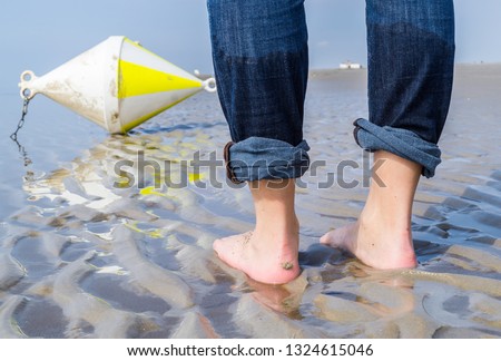 Similar – Image, Stock Photo Man stands with Frisian mink on the coast in the dunes