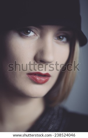 Serious portrait of girl with red lips .