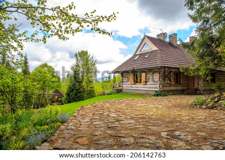 Beautiful wooden cottage somewhere in forest