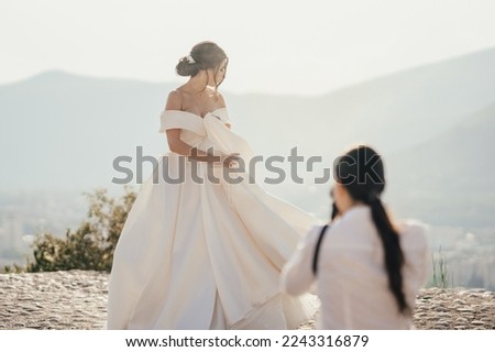 Similar – Image, Stock Photo Female photographer working on photos on laptop and camera