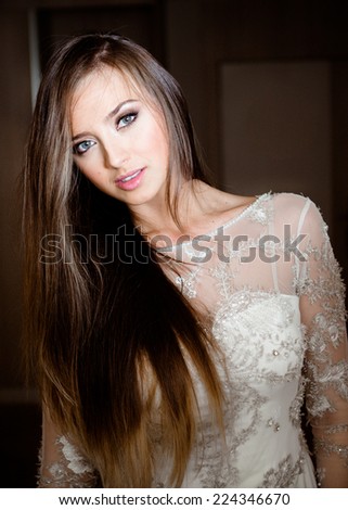 Beauty portrait of a beautiful spa woman in hotel room. Perfect fresh skin. Pure beauty model girl. Youth and skin care concept. Gorgeous bride to be before the wedding