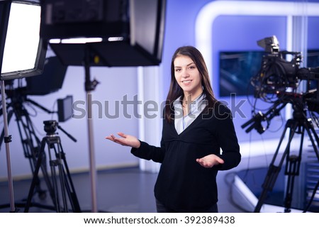 Television presenter recording in television news studio.Female ...