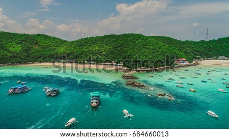Tawaen and Tong Lang beach aerial. Koh Larn island and his tropical beaches. Beautiful Thailand seaside landscape.Crystal clear water beach with speed boats anchored. Pattaya city, Thailand.