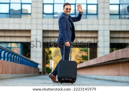 Similar – Image, Stock Photo Stylish businessman with suitcase in city