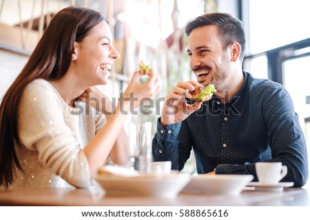 https://image.shutterstock.com/display_pic_with_logo/163641428/588865616/stock-photo-happy-loving-couple-enjoying-breakfast-in-a-cafe-love-dating-food-lifestyle-588865616.jpg