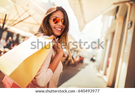 Woman in shopping. Happy woman with shopping bags enjoying in shopping. Consumerism, shopping, lifestyle concept 商業照片 © 