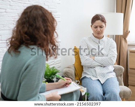 Worried caucasian woman at a session with a psychotherapist.  Сток-фото © 