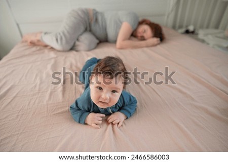 Similar – Image, Stock Photo 3 month old baby doing tummy time; bohemian interior room with houseplants