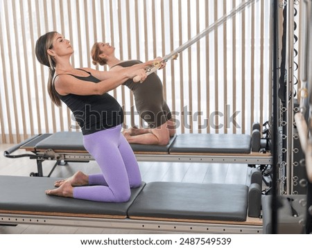 Similar – Image, Stock Photo Pregnant woman exercising with personal trainer