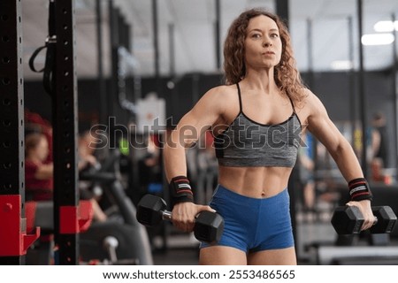 Similar – Foto Bild Frau Training mit Hanteln im Fitnessstudio