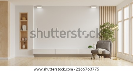 Mockup a TV wall mounted with armchair in living room with a white wall.3d rendering Сток-фото © 