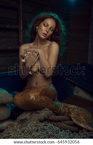 Similar – Image, Stock Photo Redhead fairytale female mermaid swimming underwater