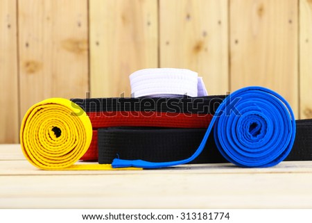 Color belt of martial art on wood floor