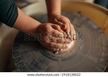 Similar – Image, Stock Photo Ceramist hands make a plate of clay