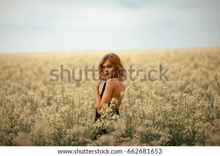 Similar – Image, Stock Photo Carefree woman with flowers on hill