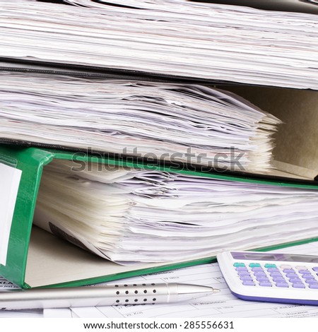 Stack of file folders with documents
