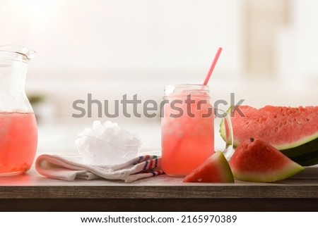 Watermelon slush with sliced fruit and crushed ice in a bowl on wooden table in a kitchen. Front view. Horizontal composition. Stock foto © 