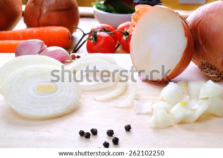 onion prepared on cutting board to be cooked