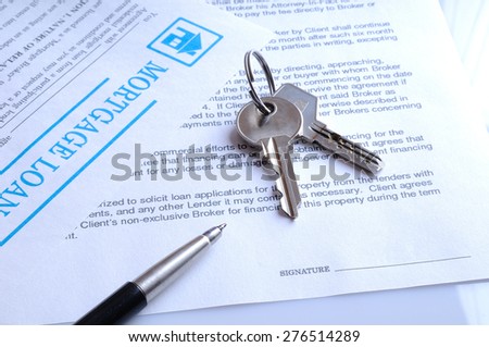 mortgage contract for signature with detail of keys to buying a home