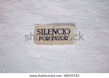 silence please advice on a white wall