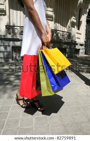 brunette woman with white dress walking in Madrid city Spain