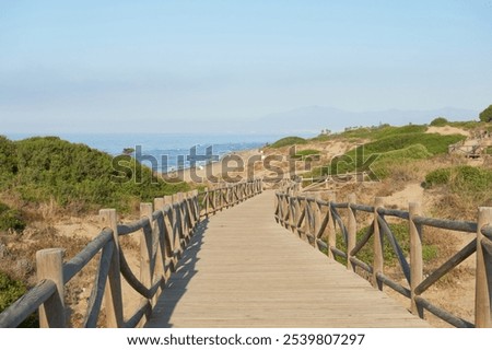 Foto Bild Holzweg zum Meer auf Sylt an einem Regentag