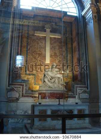 Stone Mary and Jesus with a cross in the Vatican Museum.