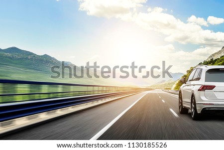 Similar – Image, Stock Photo Traveler driving car along road