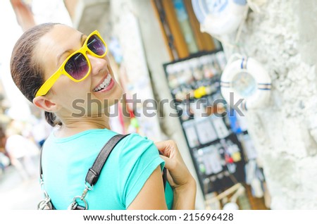 Attractive girl tourist, smiling walking outdoors