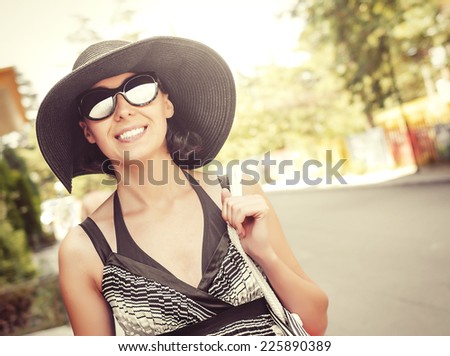 Attractive girl tourist, smiling walking outdoors.