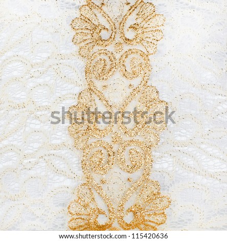 background of the Golden lace with rich ornaments and white satin covered with white lace with a big bow and waves tissue occupying the entire surface of the background