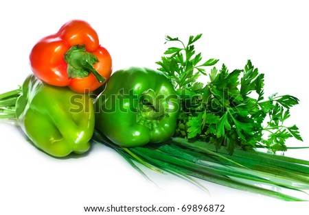 Pepper sweet red and green with a green onions and parsley isolated on a white background