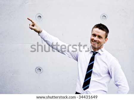 Photo Of A Handsome Corporate Man Pointing Up
