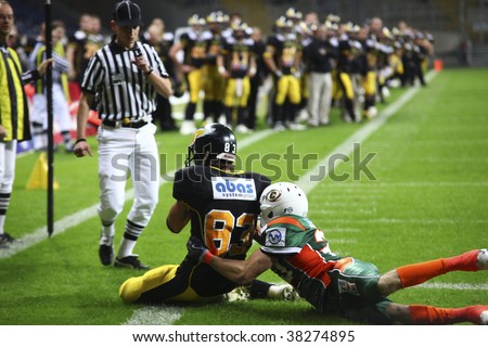 FRANKFURT - OCT 3: Wide Receiver of Berlin Adlers Pascal Heck saves the ball for his team at German Bowl XXXI on Oct 3, 2009 in Frankfurt, Germany.