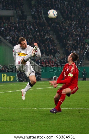 GLADBACH - MAR 21: Tony Jantschke wins the duel against Franck Ribery during a DFB Cup match between Borussia Gladbach & FC Bayern Munich, final score 2 - 4, on Mar 21, 2012, in Gladbach, Germany.